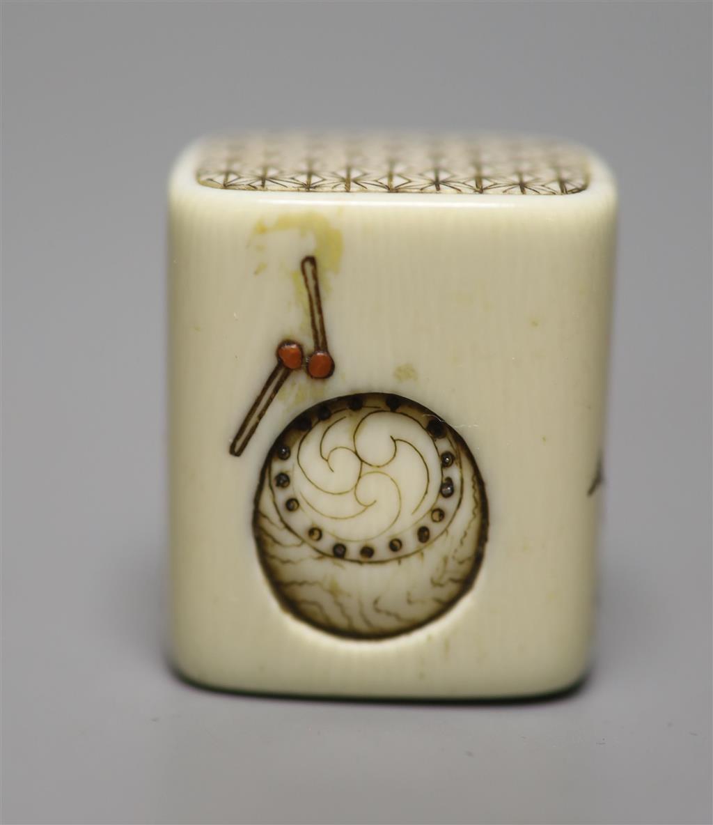 An ivory netsuke in the form of a pillow, Meiji period, height 3cm